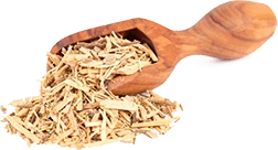 Dried muira puama root shavings on a wooden spoon